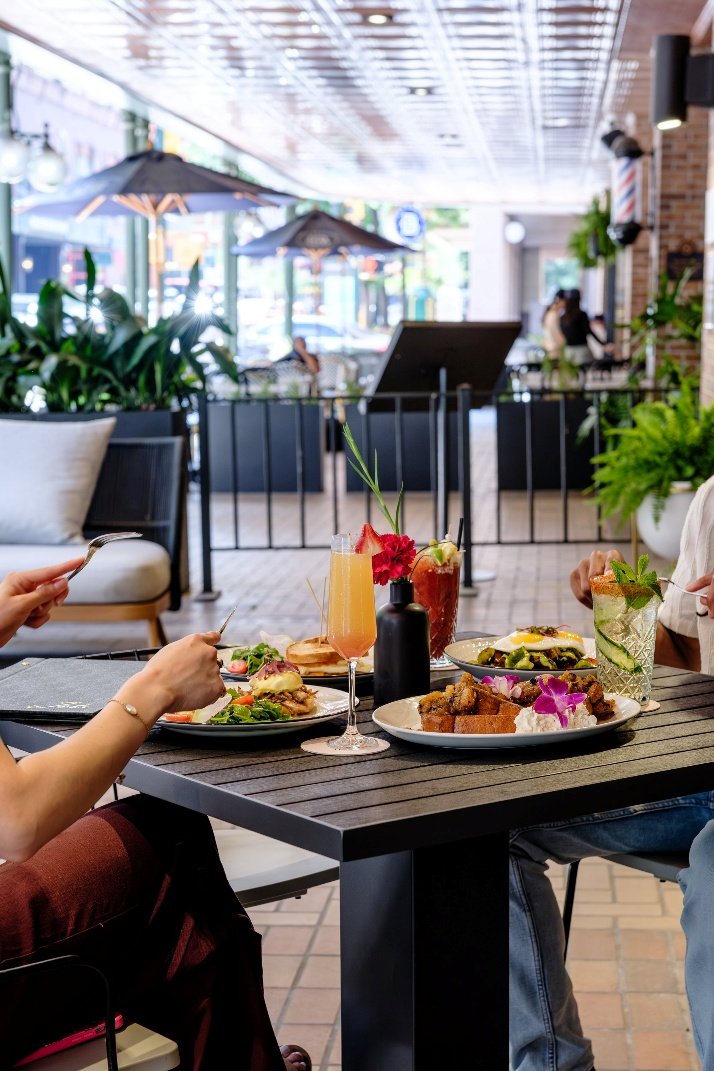 Guests dining on the patio at Jots at The Gunter Hotel on East Houston Street in downtown San Antonio